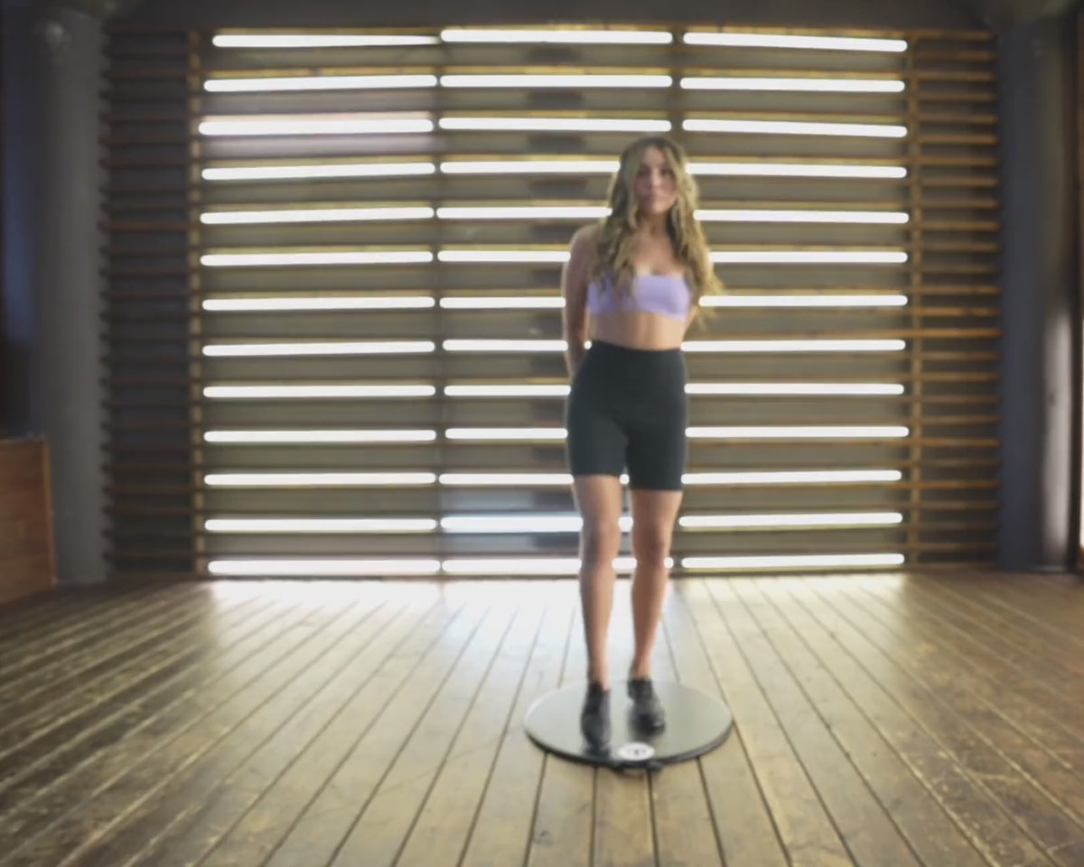 A young dancer practicing turns at home on a Dancing Disc